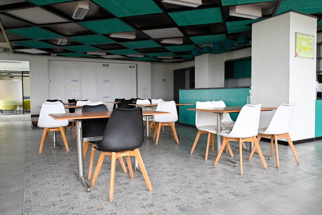 Bright editorial office space with desk and plants